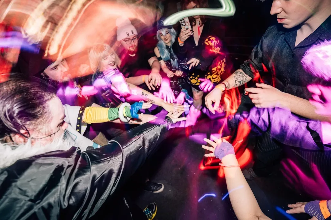 NerdyNI attendees with hands in at Anime Disco