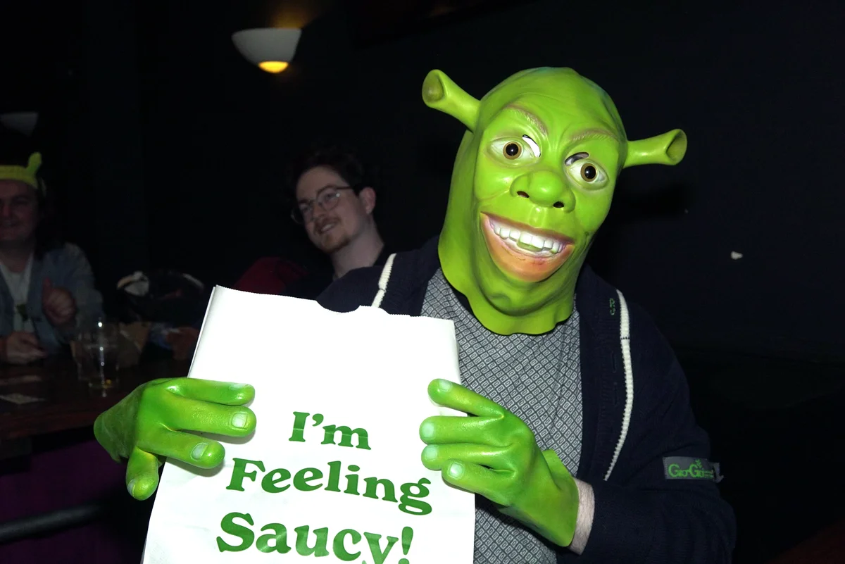 Attendee in a Shrek costume
